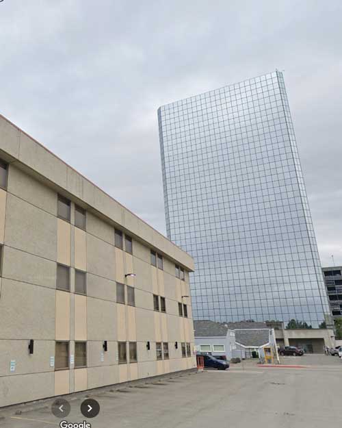 Exterior view of the Alaska Department of Health and Social Services (DHSS) building, overseeing childcare regulations and daycare cost in Alaska.