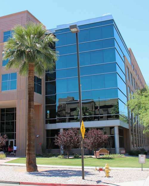 Exterior view of the Arizona Department of Health Services (ADHS) building, which regulates daycare costs and childcare policies in Arizona.