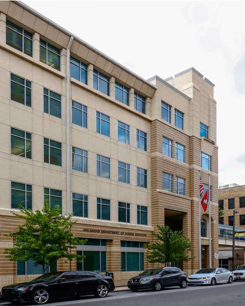 Exterior view of the Arkansas Department of Human Services (DHS) building, managing daycare costs and childcare policies in Arkansas.