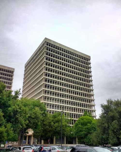 Exterior view of the California Department of Social Services (CDSS) building, overseeing daycare regulations and costs in California.