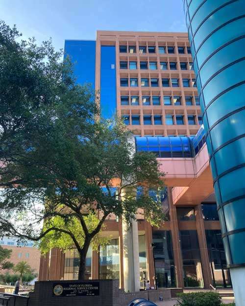 Exterior view of the Florida Department of Children and Families (DCF) building, overseeing daycare costs and childcare regulations in Florida.