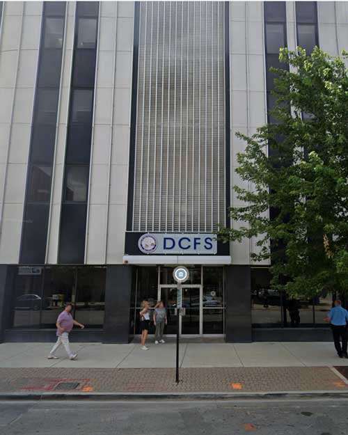 "Exterior view of the Illinois Department of Children and Family Services (DCFS) building, overseeing daycare costs and childcare regulations in Illinois