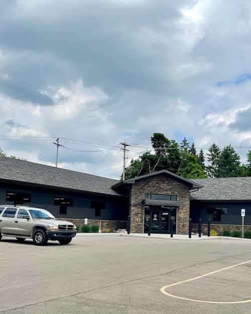 Exterior view of the Michigan Department of Licensing and Regulatory Affairs (LARA) building, responsible for regulating daycare costs and childcare facility standards in Michigan.