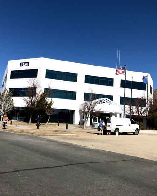 Exterior view of the Nevada Division of Public and Behavioral Health (DPBH) building, responsible for overseeing daycare cost regulations in Nevada.