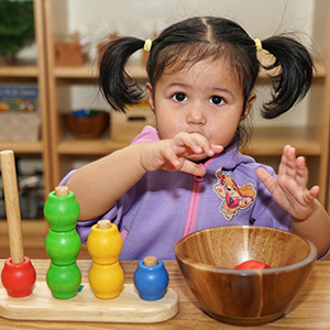 The-Childrens-House-Montessori-Windsor-Kid-playing-with-abacus.jpg